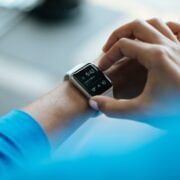 A woman's wrist with an apple watch on it.