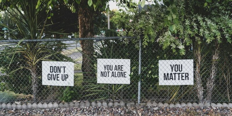 Three signs on a fence that say don't you matter.