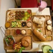 A tray of food and drinks on a table.