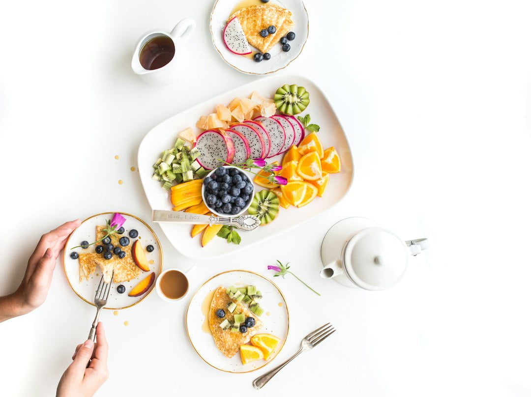 A plate of fruit and berries on plates.