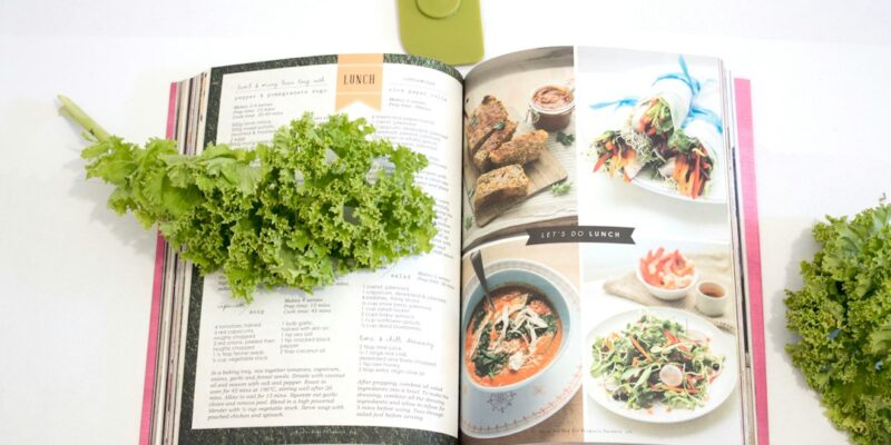 A cookbook with kale and greens on it.