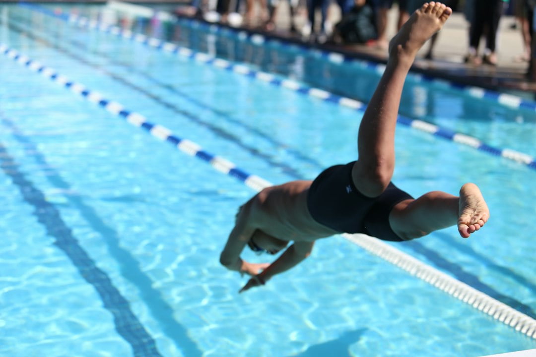 A man diving into a pool.