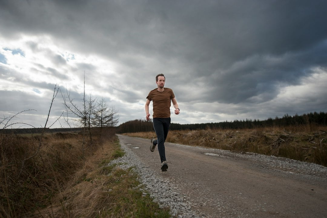 A man running on a dirt road.