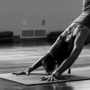 A woman doing yoga on a mat.