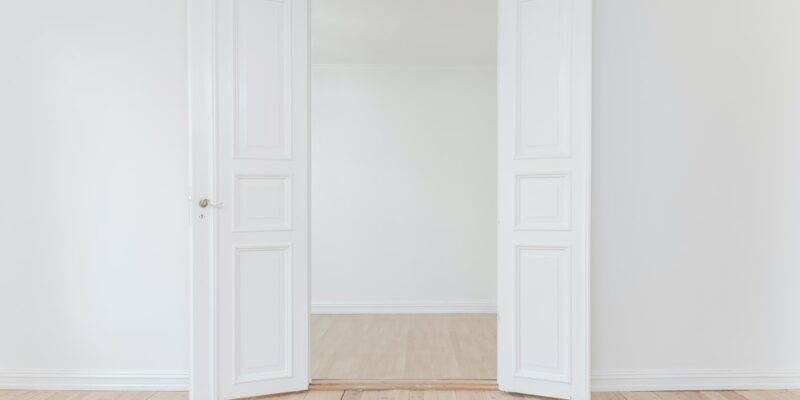 A white room with open doors.