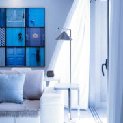 A living room with blue doors on the wall.