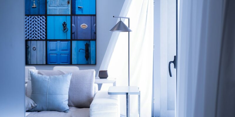 A living room with blue doors on the wall.