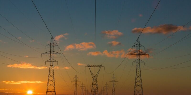 High voltage pylons at sunset.