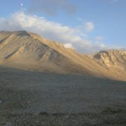 A mountain range with a lake in the background.