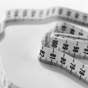 A black and white photo of a measuring tape.