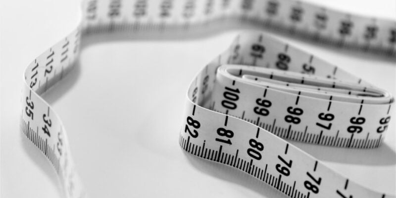 A black and white photo of a measuring tape.