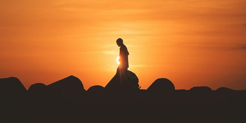 A person standing on a rock.