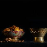 A bowl of dates and a rosary.