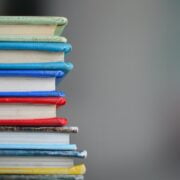 A stack of books with different colored covers.