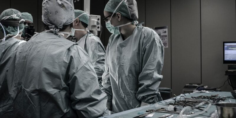 A group of surgeons in an operating room.