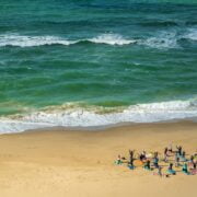 A group of people on a beach.