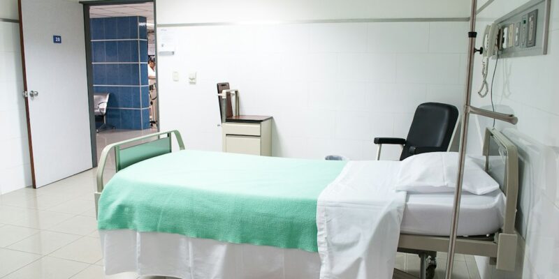 A hospital bed in a room.