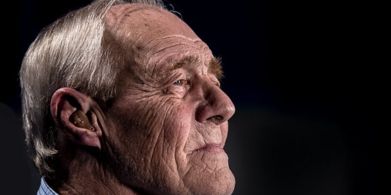 An older man looking up at the sky.