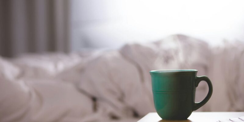 A cup of coffee on a table.