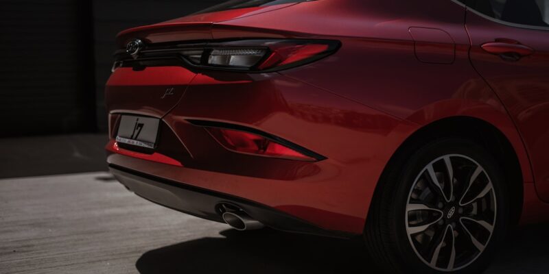 The rear end of a red 2020 hyundai elantra.