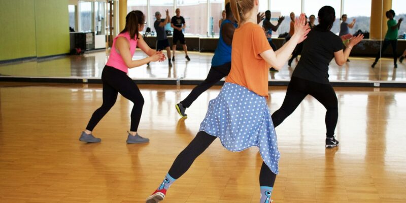 A group of people in a dance class.