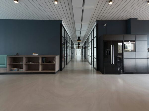 Modern office interior with sleek furnishings and neutral color tones.