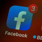 The Facebook logo, often questioned during outages on why Facebook is down, is displayed on a cell phone, reminding us why we should not panic to avoid health issues.