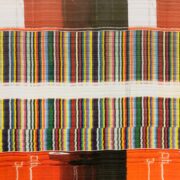 A colorful, abstract pattern with vertical stripes in shades of orange, red, green, blue, yellow, and white creates a visually complex texture reminiscent of Modern Literature's diverse narratives.