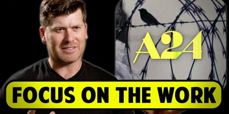 A person speaking next to a screen displaying a bird on barbed wire with "A24" text. The caption reads "Focus on the Work" in bold yellow.