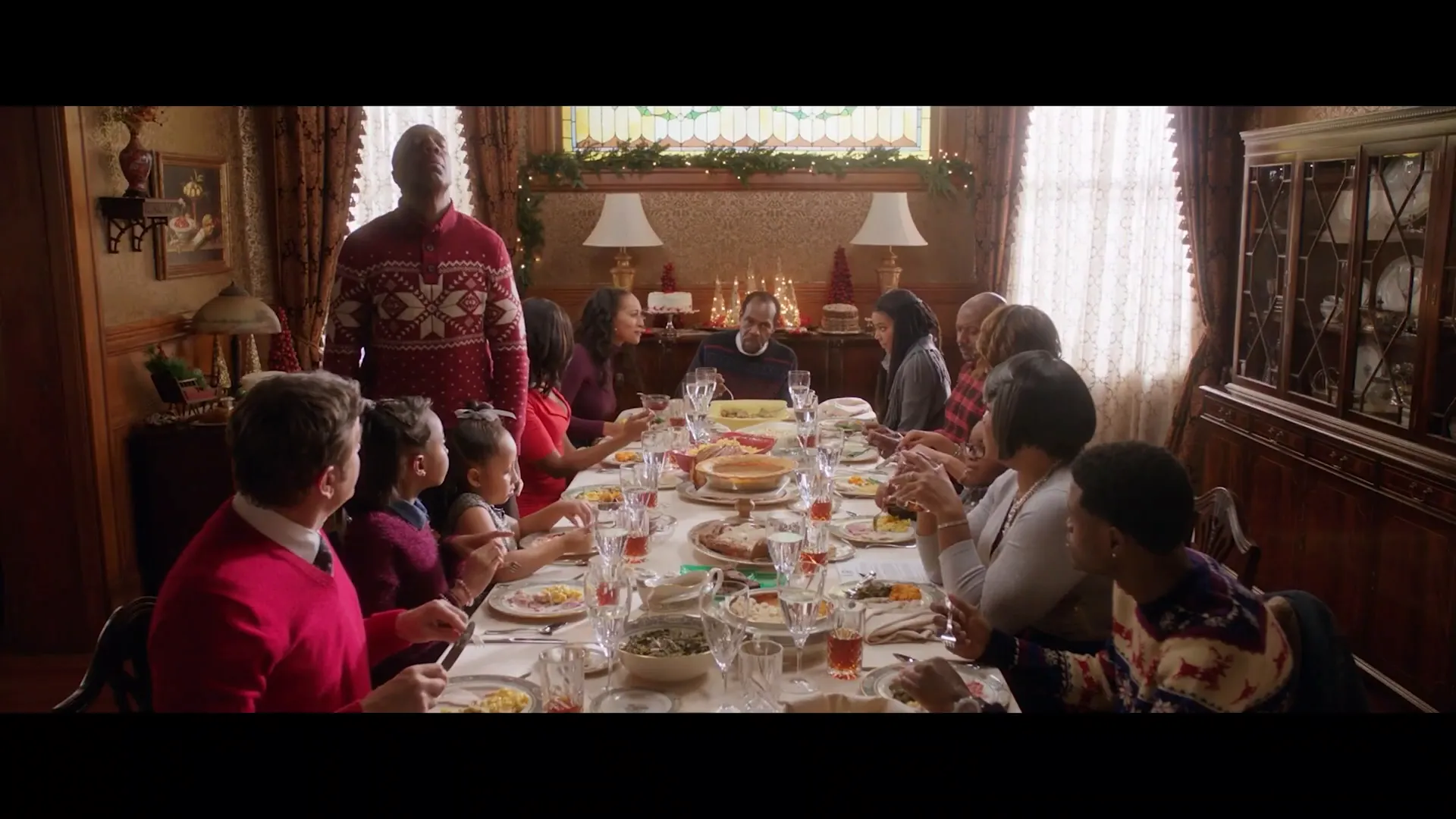 Family gathering around the dinner table